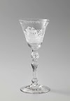 Wine glass with two dogs in a carriage drawn by two hares