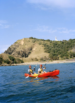A couple kayaks around the front of the Cape Byron lighthouse in Byron Bay in the Northern Rivers/Tropical NSW region, Australia.