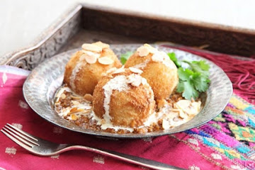 Malai kofta with spicy gravy