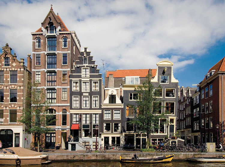 Traditional buildings on a canal in Amsterdam, capital of the Netherlands.