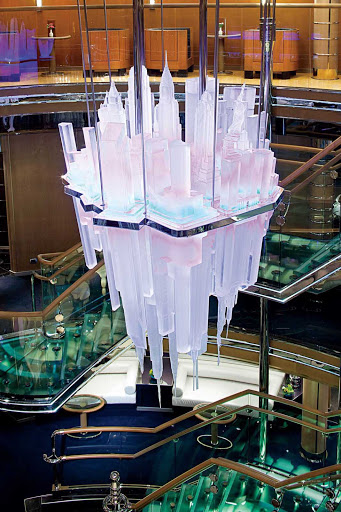 Holland-America-Nieuw-Amsterdam-Atrium - The three-deck-tall Atrium aboard Holland America Line's Nieuw Amsterdam is  designed with a glass staircase and a rotating chandelier depicting New York.