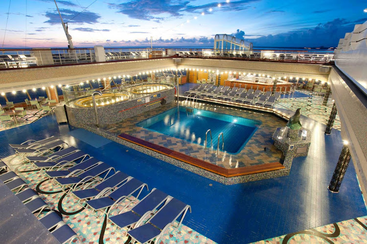 The Versailles Pool on Carnival Liberty features two spas, one great pool and a whole lot of deck chairs.