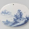 Two oval plaques with landscapes
