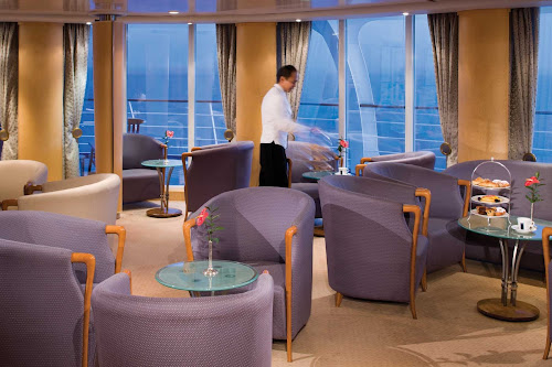 Get a complimentary drink, listen to elegant music and mingle with friends in the Panorama Lounge onboard Silver Whisper.