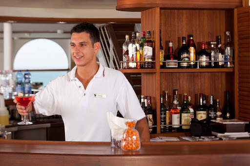 Seabourn_Sky_Bar_bartender - At the Sky Bar on Seabourn Odyssey, you'll find open air drinking, entertainment and attentive bartenders.