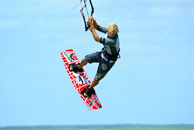 A kiteboarder catches some air along the coast of Mexico. Try it or just watch at Morph Kiteboarding in Tulum or El Cuyo, Yucatán. 