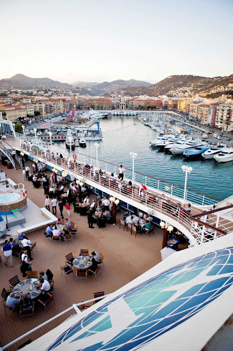 Guests dine right in the harbor during a White Night event on Azamara.