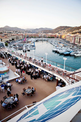 Guests dine right in the harbor during a White Night event on Azamara.