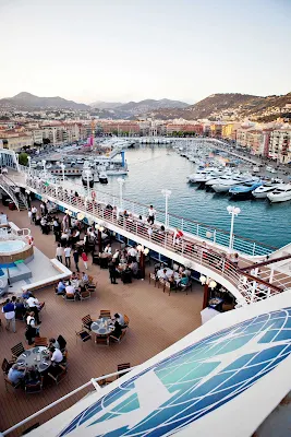 Guests dine right in the harbor during a White Night event on Azamara.