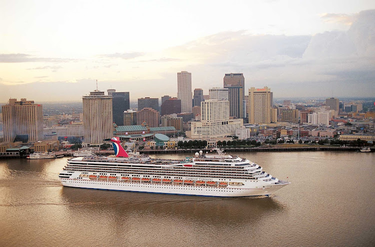 Carnival Conquest cruises past the New Orleans skyline.