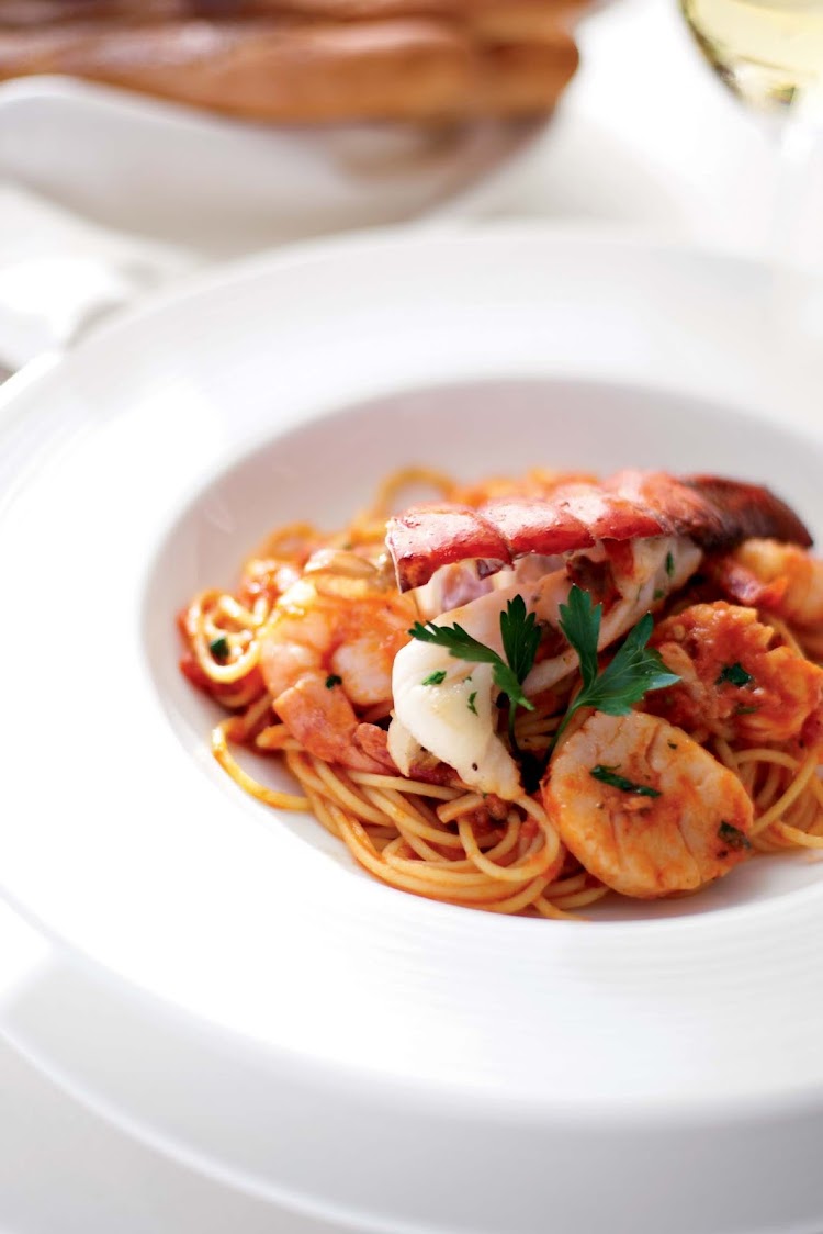 Indulge on lobster pasta during your Crystal Symphony voyage.