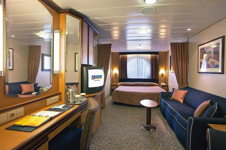 The Oceanview Stateroom on Jewel of the Seas offers guests two twin beds that convert to a Royal King-size bed, a sitting area, television and private bathroom.