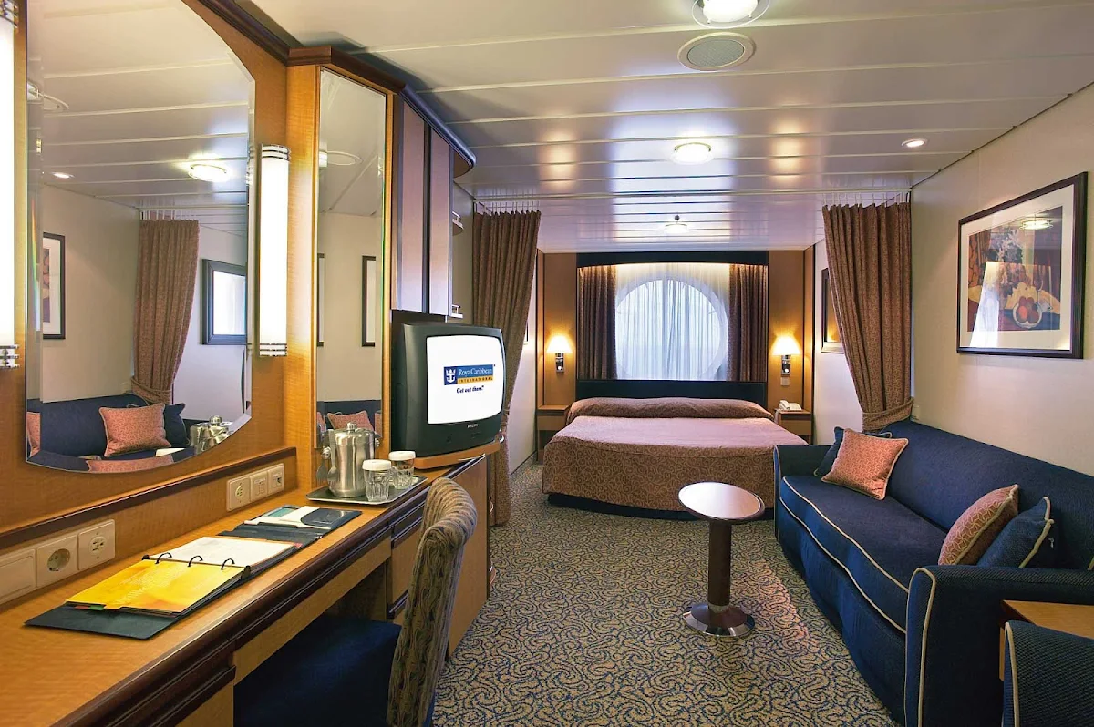 Jewel-of-the-Seas-Oceanview-Stateroom - The Oceanview Stateroom on Jewel of the Seas offers guests two twin beds that convert to a Royal King-size bed, a sitting area, television and private bathroom.