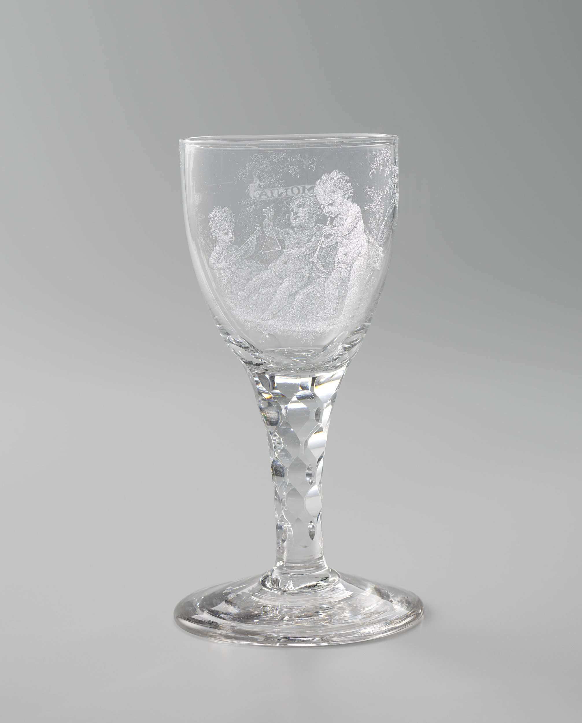 Wine glass with three music-making boys