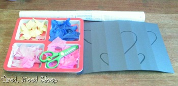 supplies - black paper, tissue paper, scissors, contact paper, marker