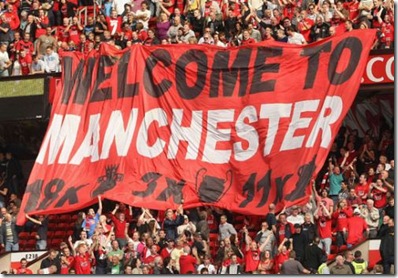 united fans unfurled this flag to show city that the reds still rule in manchester