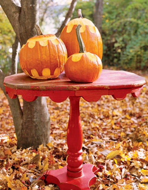red table and pumpkins