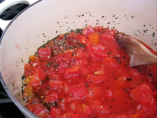 Tomatoes simmering with garlic & herbs