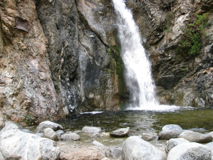 Waterfall and illegible plaque.