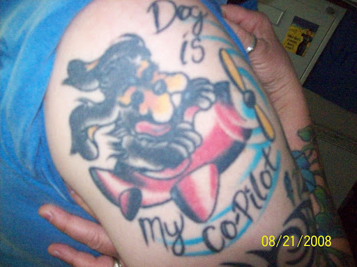 Tattoo arm cartoon co-pilot aircraft maneuver