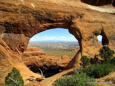 Beautiful Partition Arch, high above a panorama of Arches National Park