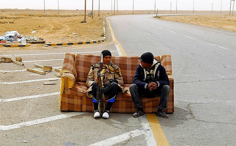 [Rebel fighters sit on a sofa at a check point in Ajdabiyah, March 15, 2011. (GORAN TOMASEVIC, Reuters)[6].jpg]
