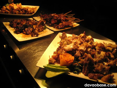 Mouth-watering meat dishes at Wild Safari Grill: Lumpia Shanghai, Chicken and Pork Barbecue, and Crispy Pata