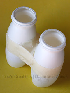 Toy binoculars made out of yogurt containers