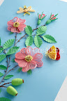 Quilled dog-rose flowers, hips, moth, and butterfly