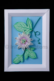 Quilled passionflower in a paper frame