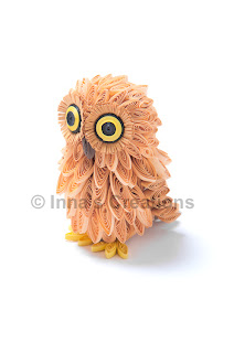 Quilled baby owl, side view