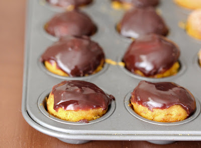 photo of mini pumpkin donuts in a muffin tin
