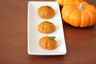 photo of three pumpkin mochi on a plate