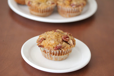 photo of one Pecan streusel pumpkin muffin on a plate