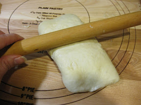 photo showing how to roll the dough after it's been folded