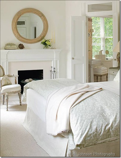 erik johnson bedroom white bed linens louis armchair chair fireplace mantel natural wood round mirror carpet rug box pleat skirt