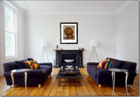 fisher hart photography white living room modern belsize park london carved crown molding two dark blue sofas black fireplace mantel