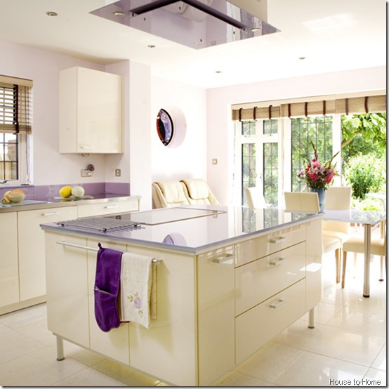 Lilac kitchen fitted cream gloss lacquer units glass worktops tiled flooring island unit ceiling lilac glass extractor fan hood French windows patio doors real home BK 03/2008 not used
