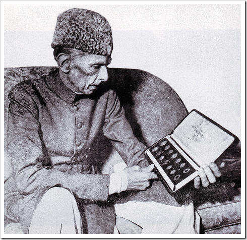 Quaid-e-Azam examines the first set of coins in Pakistan