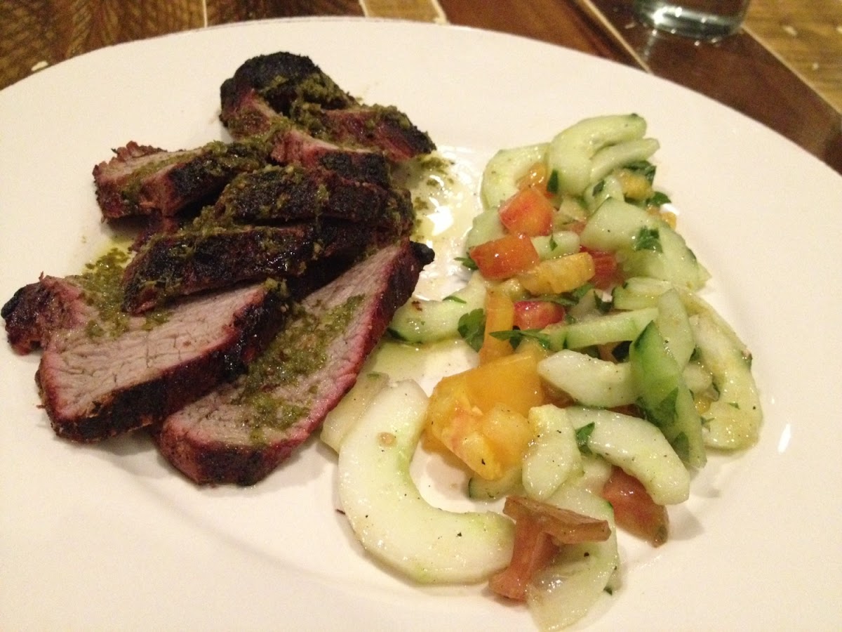 Herb crusted tri tip steak with tomato and cucumber