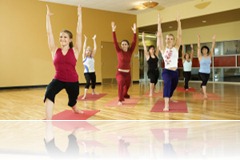Adult females in yoga class.