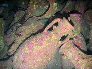 This photo taken on June 2009 shows amphorae, believed to be of Spanish origin and dating back to the 1st century A.D., lie on the seabed off the coast of Ventotene, a tiny island part of an archipelago between Rome and Naples, Italy. Archaeology officials say they have found five well-preserved Roman shipwrecks off a small Mediterranean island, with their cargo of amphorae, pots and other objects largely intact. They date from the 1st century B.C. to the 4th century and carried wine amphorae, kitchen tools and some metal and glass objects that have yet to be identified, Italy's Culture Ministry said. Collapse