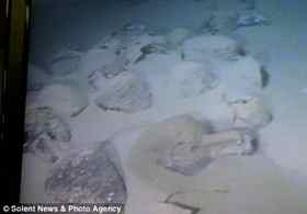An underwater research team brought up five pots from the seabed, but said there were hundreds still down there
