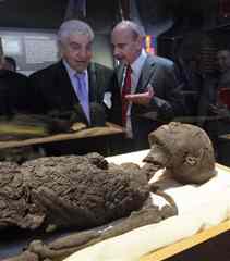 Dr. Zahi Hawass, left, Secretary General of Egypt's Supreme Council of Antiquities, and Andres Numhauser, international vice president of Arts and Exhibitions International, visit the "Replica of Tutankhamun's Body," part of the "Tutankhamun and the Golden Age of the Pharoahs" exhibit in New York, Wednesday, April 21, 2010. Recent CAT scans and DNA tests revealed that Tut fractured a leg shortly before he died. (AP Photo/Richard Drew)