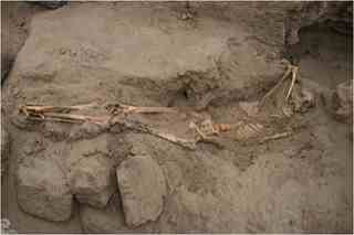 Photo courtesy Professor Edward Swenson. A picture of one of the burials. She was an adolescent. Her legs are close together indicating that they were bound. Her knees also show evidence of ritual burning. It's possible that she was sacrificed however the skeletal analysis found no evidence of trauma. 