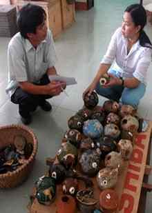 Archaeologists examine the cermaics found during the road construction