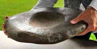 This stone mortar was found on the ground known today as Hanley Farm. Archaeologists are now surveying a site that will be leased to a seed grower for 10 years.