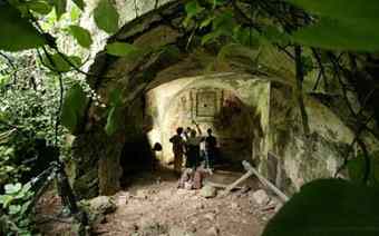 Archeologists and documentary makers inspect the interior of a grotto which is believed to sit on top of the headwaters of a 1900 year old aqueduct 