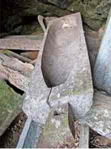 A wooden coffin inside the Po Cung grotto