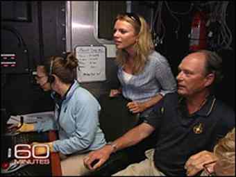 Bob Ballard, with Lara Logan, watching a feed of a shipwreck on the bottom of the Aegean Sea
